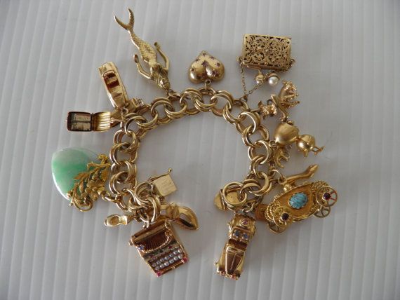 gold charms for bracelets amazing heavy chunky, 14k,18k charm bracelet..131.1 grams of gold many  working, moving pieces, jade, tozgkvk