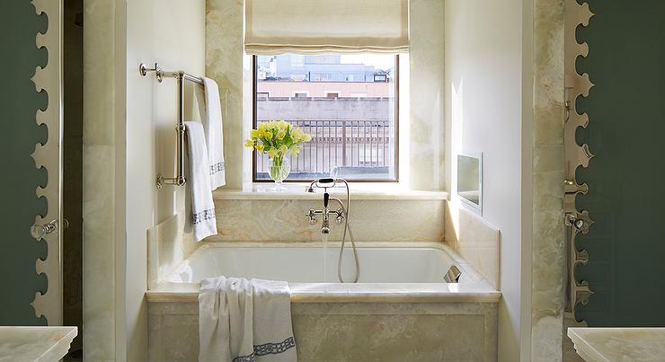 Tub Nook Flanked by His and Hers Showers with Frosted Glass and .