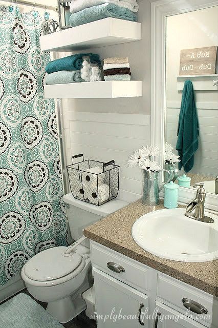 Top your toilet with a high-sided basket to use for extra storage .