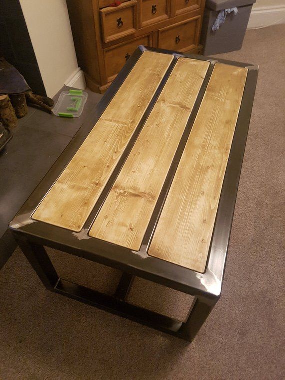 A beautiful hand made coffee table Made with 50 x 50 mild steel .