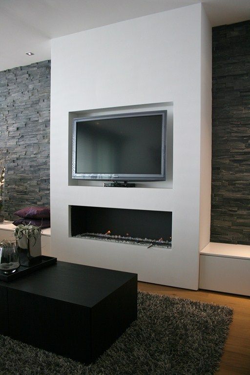 Bump out for TV and fireplace. Benches for storage on side. Stone .